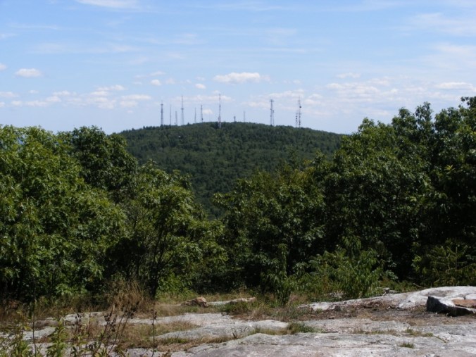hill with many cell towers and antennas