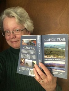 Blogger Ellen Kolb reading Cohos Trail guidebook